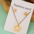 Golden stainless steel jewelry set featuring nested heart pendant necklace and stud earrings - Overlapping Heart Set