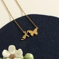 Golden stainless steel letter K butterfly pendant necklace with small heart details - Gold K