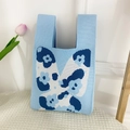 Light blue knitted handbag featuring large navy and white floral butterfly jacquard patterns - Butterfly-Blue