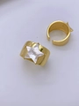 Flat lay of gold plated wide band rings featuring a star-shaped shell inlay detail - Star Shell 2pcs Set (Style B)