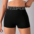 Seamless black high-waisted yoga shorts featuring a branded SPORT elastic waistband - S / Black