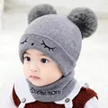 Gray baby winter knit set with double pom poms and embroidered wink face for infants - One Size / Squinting Style / Gray
