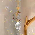 Golden sun and moon suncatcher with crystal ball creating rainbow light reflections - B19 Style