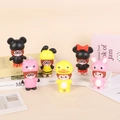 Close-up of 7 cute cartoon squishy toys with various animal hats on decorative books - Monkey Figure Large 12cm