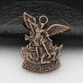 Detailed close-up of antique bronze Saint Michael metal pendant on textured surface - Red Bronze