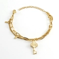 Gold double-layered stainless steel chain bracelet with floral embossed key pendants - Gold