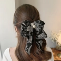 Elegante clip de pelo con lazo negro, estampado paisley y detalles de perlas falsas - Negro Floral