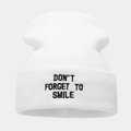 Detailed close-up of white knitted beanie with black embroidery text slogan - One Size / White