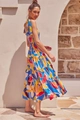 Detail of bohemian tiered floral dress featuring shoulder ties and vibrant abstract prints - Yellow Floral Print