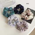 5-piece set of floral fabric scrunchies in navy, green, white, and pink patterns - Five-Piece Set / Floral