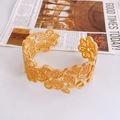 Golden open bangle featuring intricate cutout floral patterns and a vintage lace texture - Gold Floral Lace Hollow Bangle