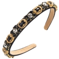 Close-up of luxury vintage headband featuring black faceted gems and gold metal details - All Black