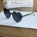 Translucent heart-shaped sunglasses with dark grey lenses and teal green temples - Grey Lens Green Temple