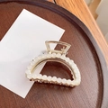 Elegant gold metal hair claw clip with white pearls on a minimalist wood base - Semicircle Claw Clip - 6.5cm