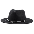 Detail of black woven sun hat with ethnic style beaded band and metal feather pendant - Black