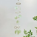 Artistic wooden moon wind chime with light green shells and natural starfish decoration - Green Starfish
