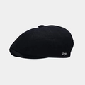 Detalle de gorra newsboy negra con bordado DYX blanco y textura de tela de algodón - Talla única / Negro