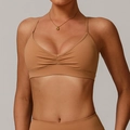 Brown V-neck sports bra with ruched front detail and cross-back straps in quick-dry fabric - L / Tops / Pumpkin Orange