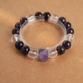 Macro shot of purple amethyst beads and clear crystal cube on a display stand - White Crystal Cube Amethyst Bracelet (With Gift Box)