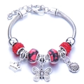 Silver charm bracelet featuring red rhinestones and princess crown pendant detail - Red