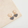 Detail of gold hoop earrings featuring heart charms with pavé set blue gemstones - Royal Blue Heart Style (ES2618-2)