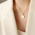 Gold plated mother of pearl shell round disc pendant necklace featuring letter B detail - Letter B (RP014)