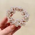 Elegant multi-layered pearl hair tie featuring white beads and golden braided thread detail - Pearl White Beaded
