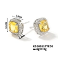 Macro detail of square yellow gemstone earrings with halo diamonds and side engraving - Yellow