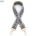 Close-up of vintage floral embroidery on adjustable guitar style wide bag strap - A-6 Khaki Light Blue