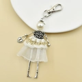 Detail of handmade cartoon doll keychain with pearl head, rhinestone body and gold tassels - 15-Luxury Fringe Mesh Doll