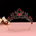 Detailed macro of a Gothic crown with red crystal teardrop and dark metal filigree - No.2 Antique Gold (Red Stone)