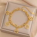 Double-layered gold stainless steel bracelet featuring five circular M letter pendants - Gold Double Layer Bracelet (965)