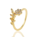 Golden flower and leaf ring with sparkling zircons on a white reflective surface - Gold Six-petal Flower Leaf