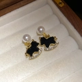 Detail of gold rocking horse earrings with black inlay and glossy white pearls - 67# Gold Black Rocking Horse Pearl Zirconia Earrings (Pair)