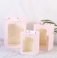 Pink paper gift bags with clear window and ribbon handles in three different sizes - H20*L15*W10cm / Pink