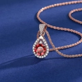 Pear-shaped rose gold necklace with a large round red gemstone and white diamond accents - 3-carat Champagne Gold Red Diamond Necklace Xl-52 [with Starry Chain]