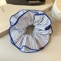 Blue and white striped fabric scrunchie with pleated texture on a soft cream background - White & Blue Stripes 4-Layer