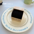 High elasticity black hair ties in a kraft paper box on a decorative ceramic plate - Black 5 Pcs Set