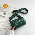 Green quilted nylon crossbody bag with diamond stitching and adjustable strap on white fabric - Green