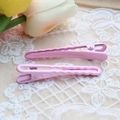 Close-up of pink gradient metal hair clips on beige lace fabric with tulip background - Light Pink