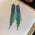 Macro shot of gradient blue and green rhinestone fringe earrings on silk jewelry tray - Triangular Rhinestone Tassel (38#) / Blue Green Gradient