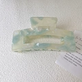 Large acetate hair claw clip with light green and blue marble pattern for women - Cyan