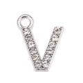 Close-up of letter V pendant with sparkling rhinestones on silver metal base - Letter V