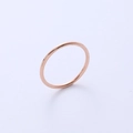 Minimalist ultra-thin titanium steel ring in rose gold finish shown on a light gray background - US 4 / Rose Gold