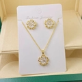 Close-up of elegant gold flower necklace and earring set with crystals on display - Gold Flower Set (D)