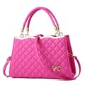 Rose pink quilted handbag with gold bow detail and detachable strap on white background - Rose Red
