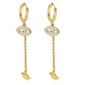 Detailed macro of gold tassel earrings with evil eye pendant and crystal accents - Gold-1 Oval (MS-770)