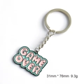 Pink and green Game Over metal keychain with pixel heart design and enamel finish - Game Over Letters