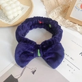 Dark blue coral fleece headband with bow and colored dots for skincare or makeup - Pattern 5