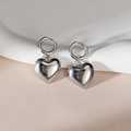 Minimalist silver shell-shaped heart hoop earrings on smooth silk fabric background - Steel Color - Heart Shape